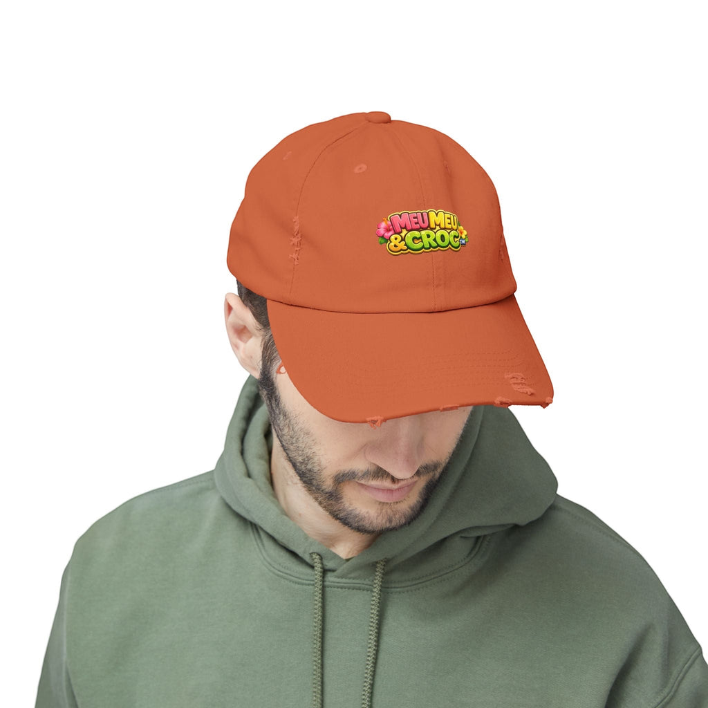 Man wearing an orange Meu Meu & Croc Tropical Store distressed baseball cap with a vintage worn-in look.