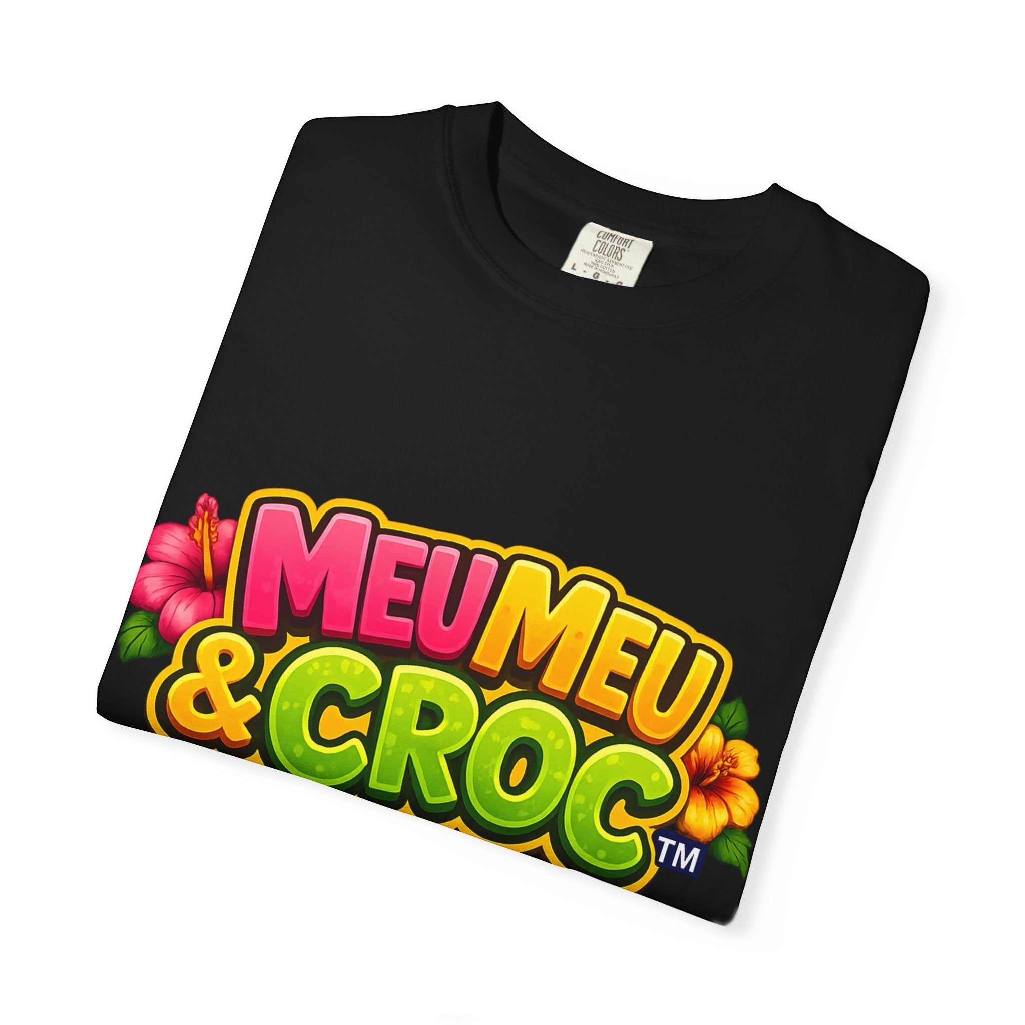Meu Meu & Croc Tropical Store black crew neck graphic t-shirt with colorful tropical floral logo design.