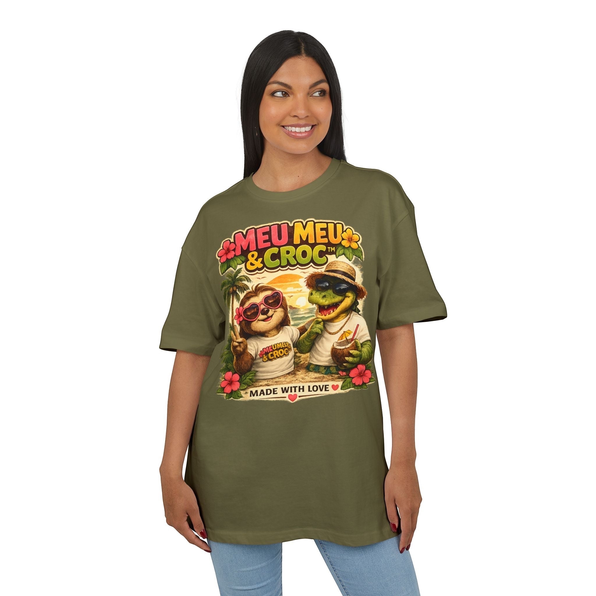 Woman wearing an olive green Meu Meu & Croc Tropical Store oversized cotton tee with a tropical sloth and croc graphic.