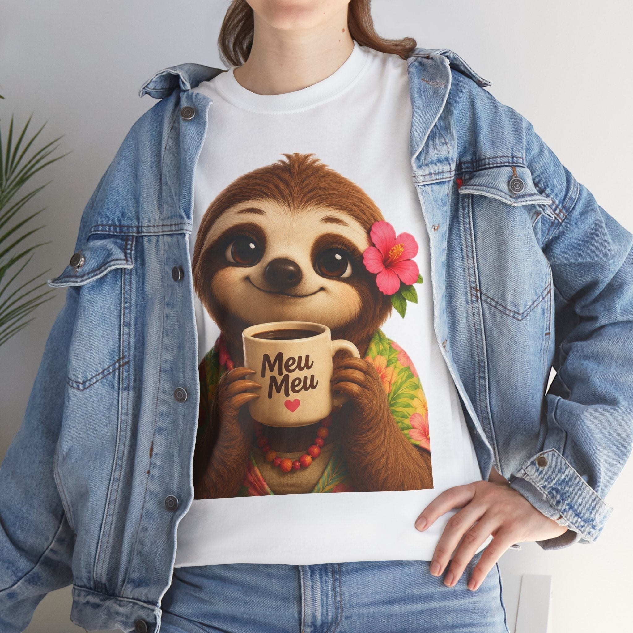 Woman wearing a Meu Meu & Croc Tropical Store white cotton t-shirt with a cute sloth graphic holding a coffee mug.