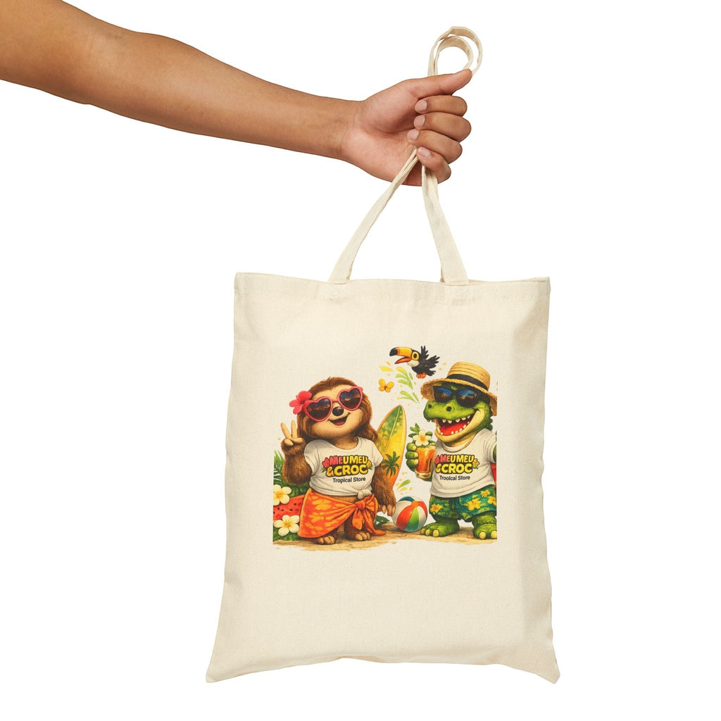 Meu Meu & Croc Tropical Store natural cotton canvas tote bag with cute sloth and crocodile beach vacation graphic.