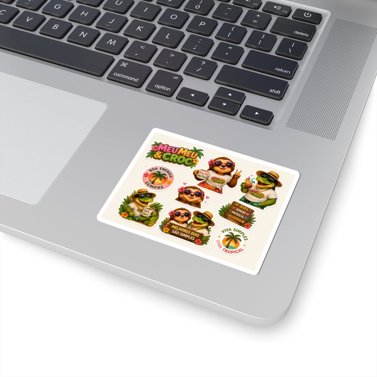 Meu Meu & Croc Tropical Store kiss-cut sticker sheet featuring sloth and crocodile characters on a laptop.