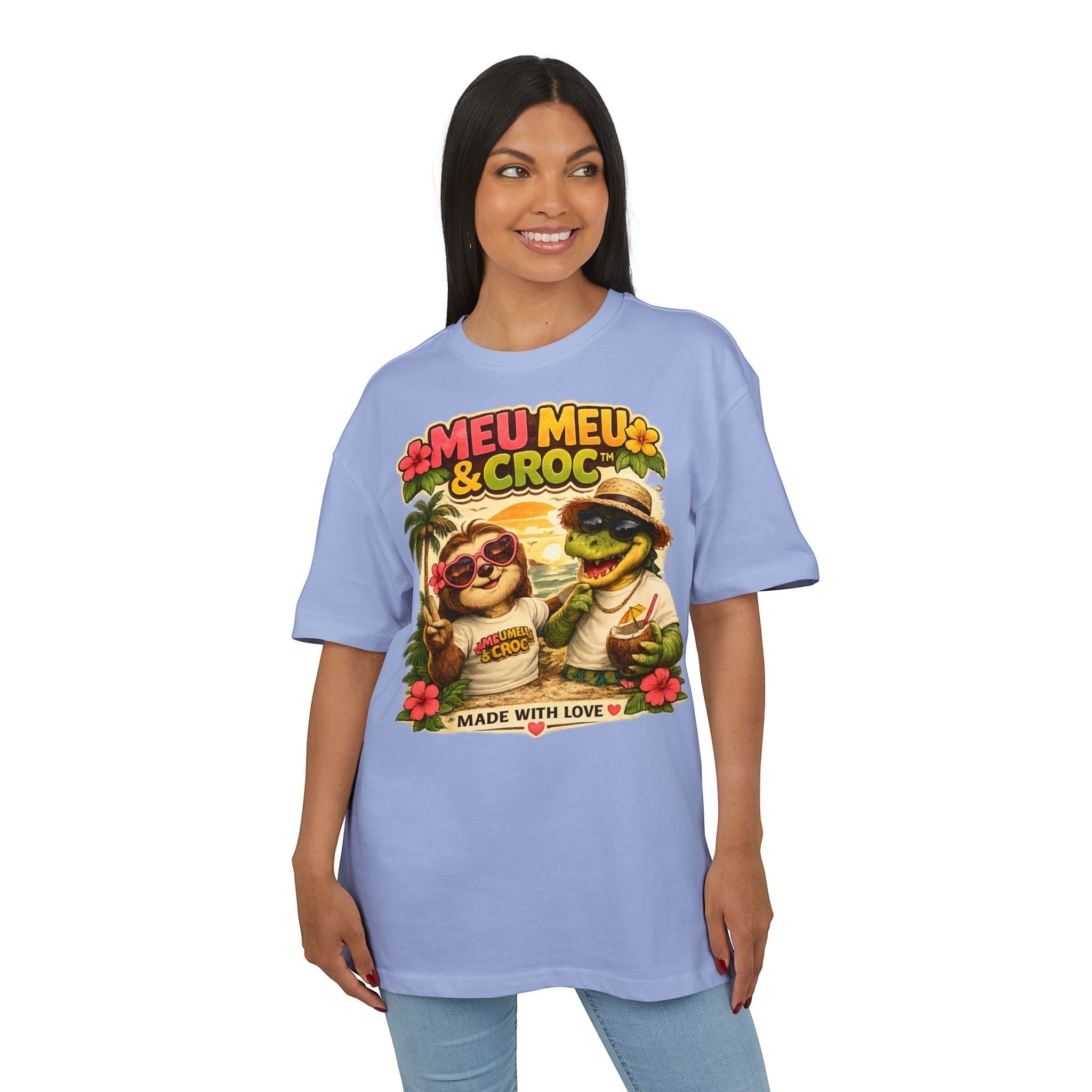 Woman wearing a Meu Meu & Croc Tropical Store light blue oversized cotton graphic tee with sloth and crocodile print.