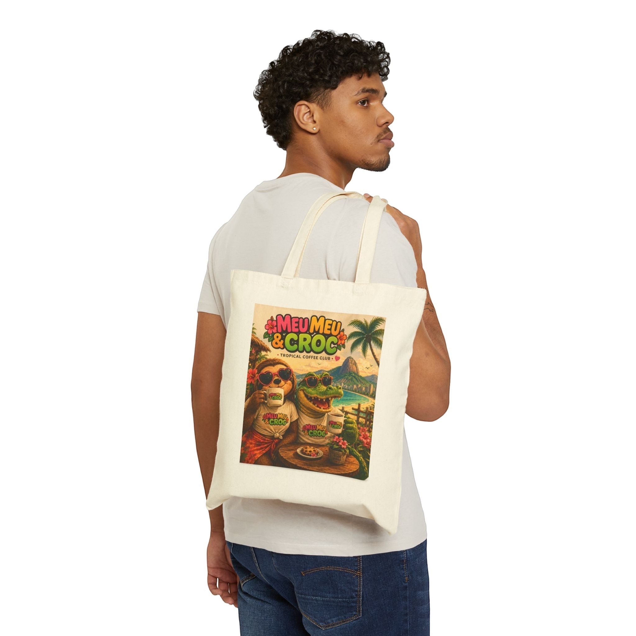 Man wearing a Meu Meu & Croc Tropical Store natural cotton canvas tote bag with vintage tropical graphic print.